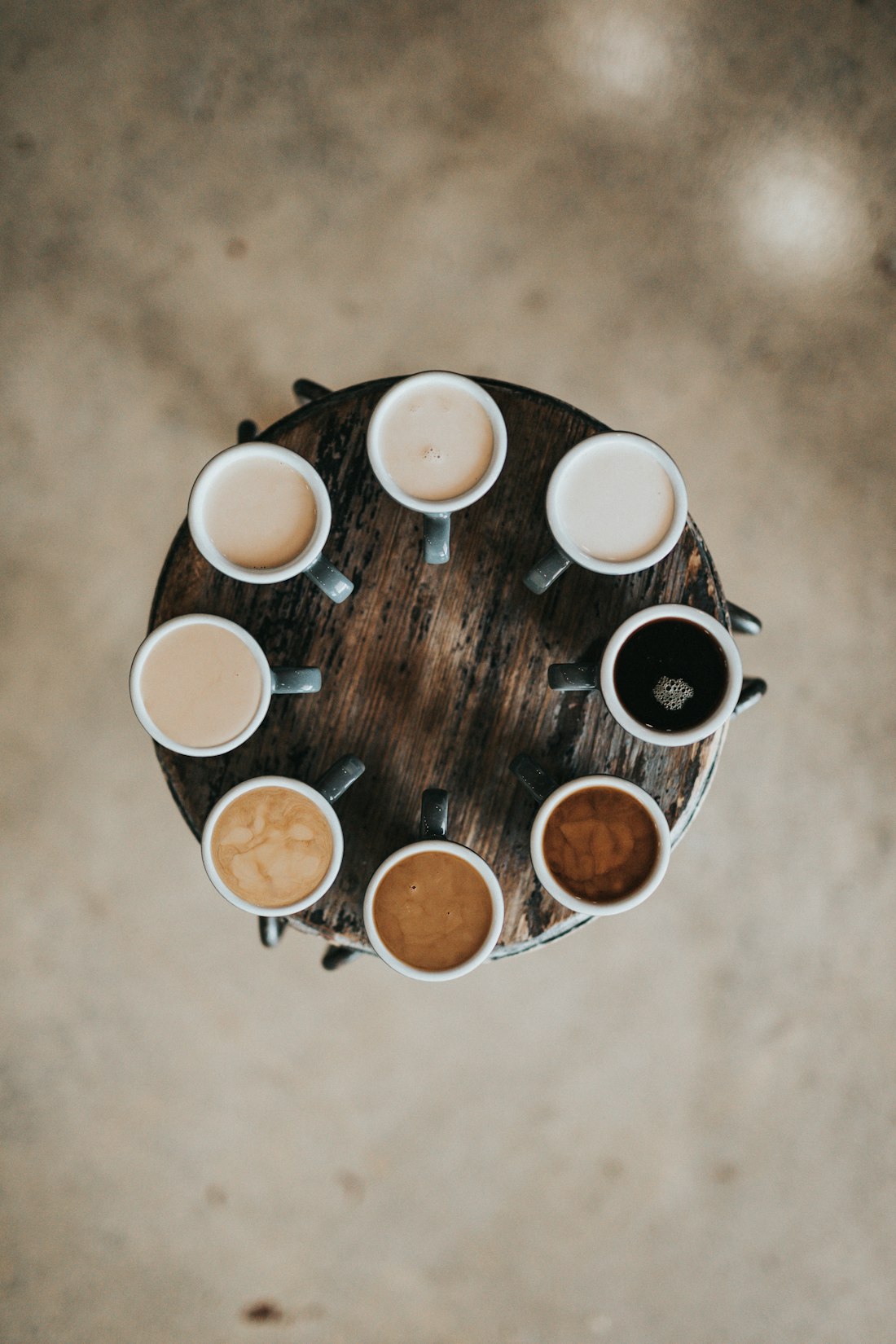 Coffee cups arranged on a wooden stool
